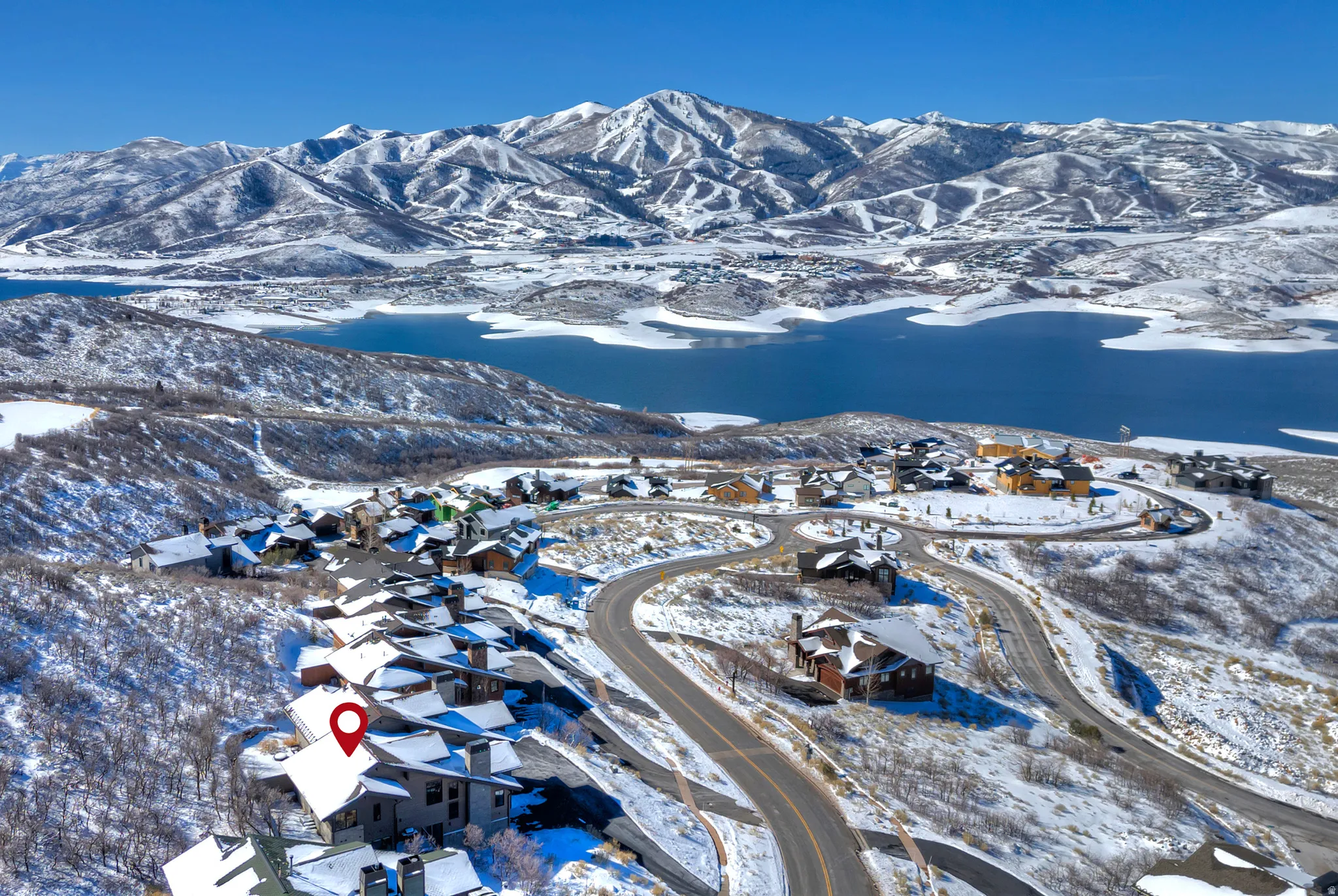Snowy aerial view with a mountain view