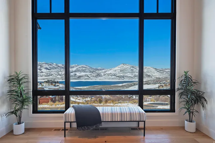 Bedroom with a mountain view and wood-type flooring