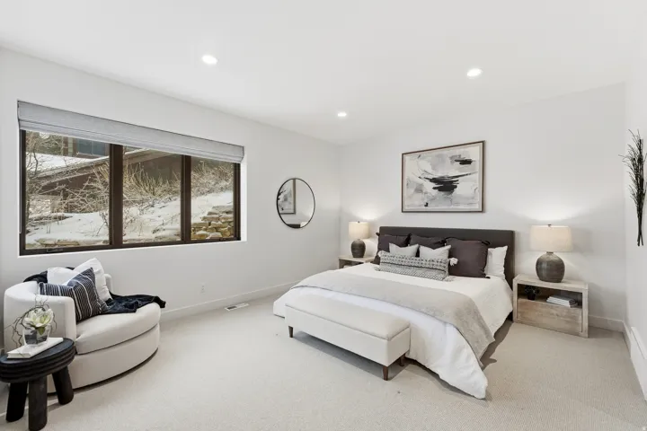 Bedroom featuring light colored carpet and recessed lighting