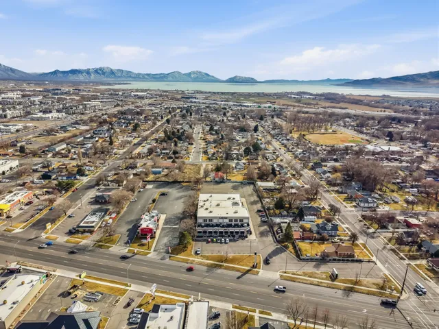 Aerial view of property and surrounding area featuring mountains