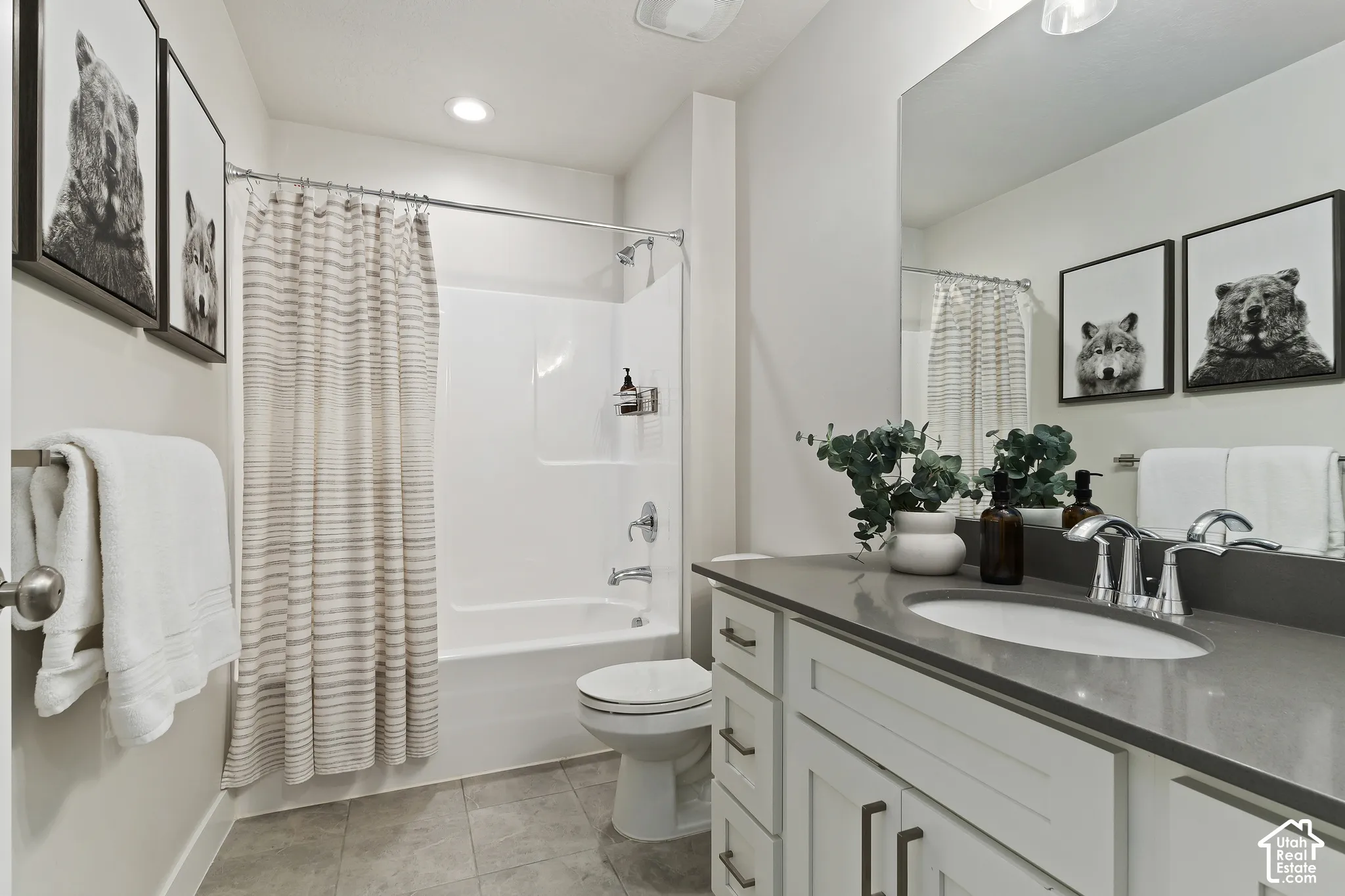 Great room showcasing soaring two-story ceilings, expansive windows, and an open floor plan designed for gathering.