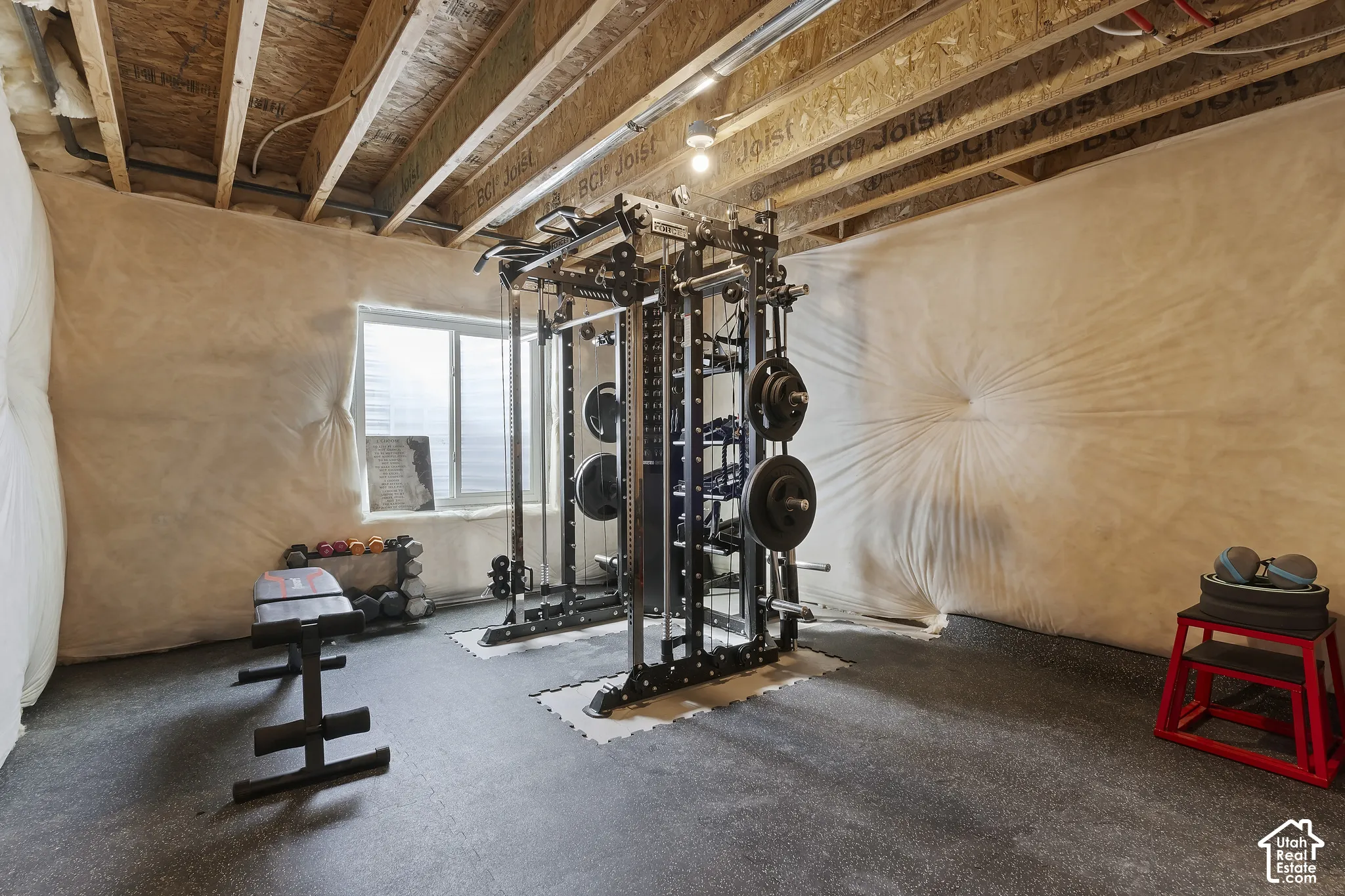 Unfinished basement currently configured as a home gym, offering room to expand and build equity.