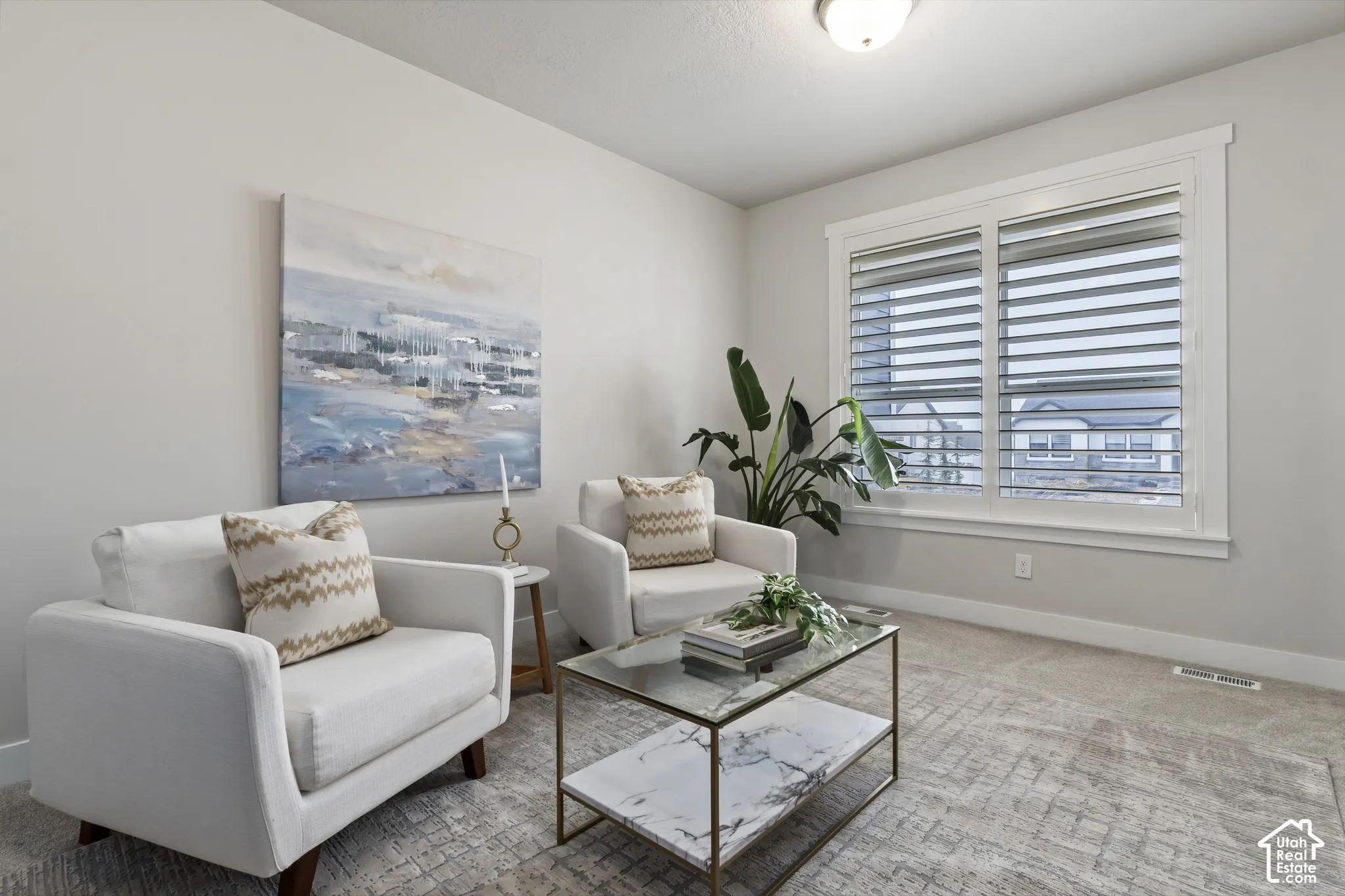 Formal sitting room offering flexible space for conversation, reading, or additional living area.