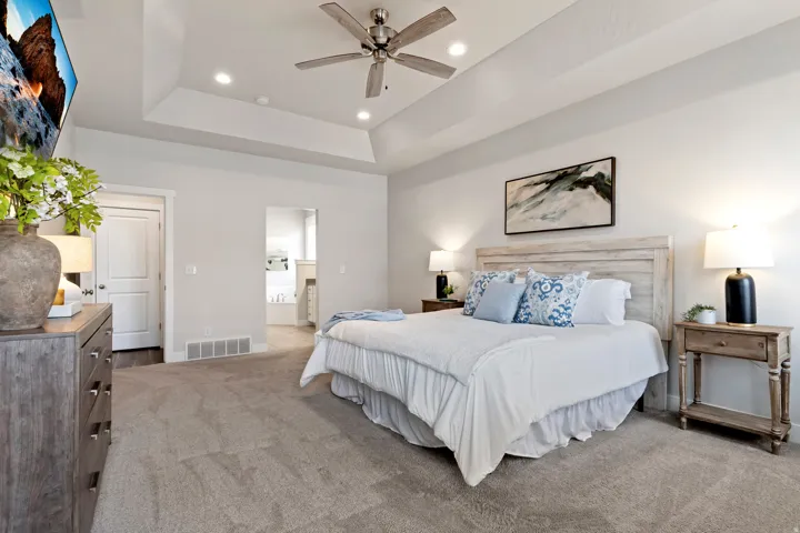 Main-level primary suite offering privacy, generous square footage, and convenient single-level living.
