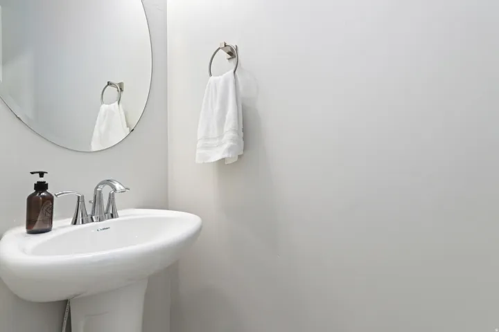 Convenient main-level powder bathroom for guests.