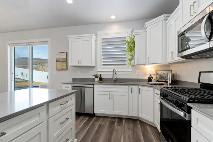 Dining area overlooking the backyard with easy access to the patio for indoor-outdoor entertaining.
