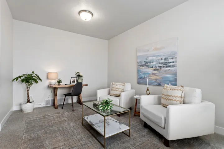 Additional main-level flex room ideal for a home office, music room, or formal sitting area.