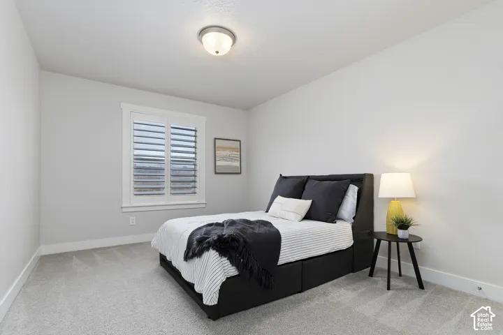 Additional upstairs bedroom with spacious layout, neutral finishes, and large closet.