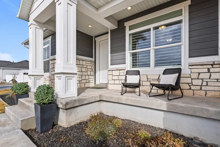 Covered front porch with space to relax and enjoy the neighborhood.