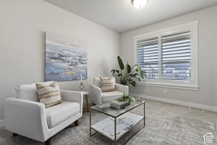 Formal sitting room offering flexible space for conversation, reading, or additional living area.