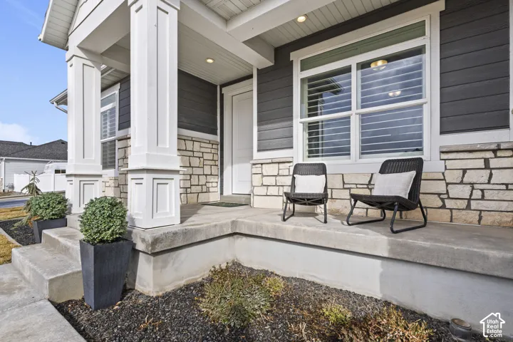 Covered front porch with space to relax and enjoy the neighborhood.