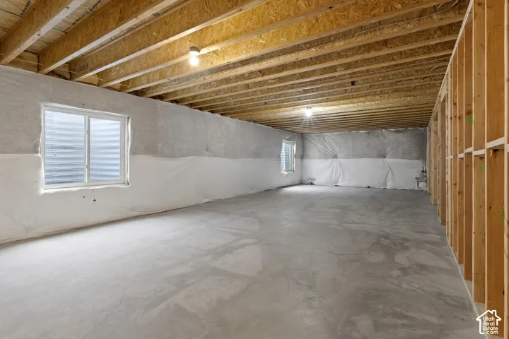 Expansive unfinished basement ready for future bedrooms, a theater, gym, or additional living space.
