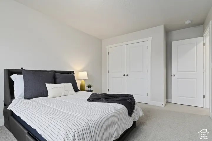 Secondary bedroom featuring generous closet space and flexible use for guests or family.