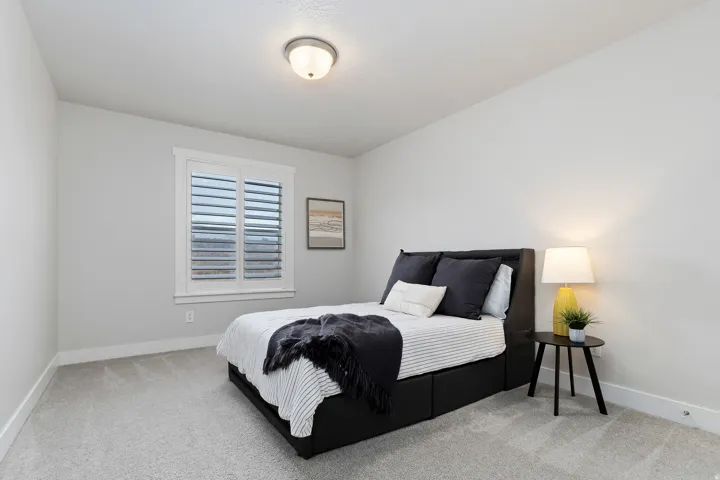 Additional upstairs bedroom with spacious layout, neutral finishes, and large closet.