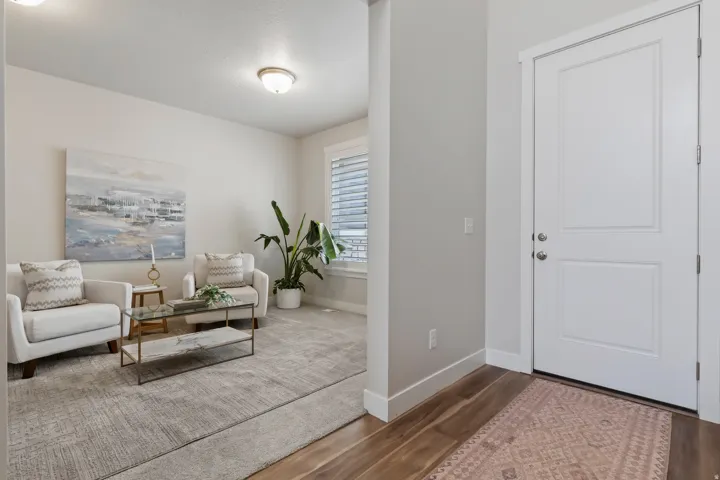 Additional main-level flex room ideal for a home office, music room, or formal sitting area.