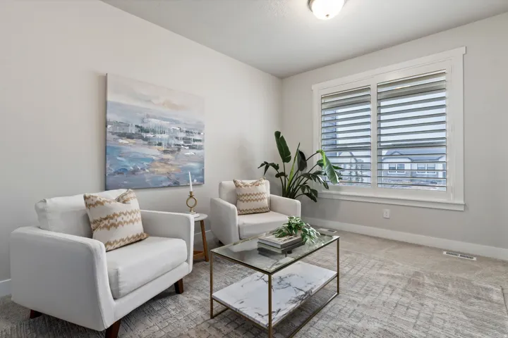 Formal sitting room offering flexible space for conversation, reading, or additional living area.