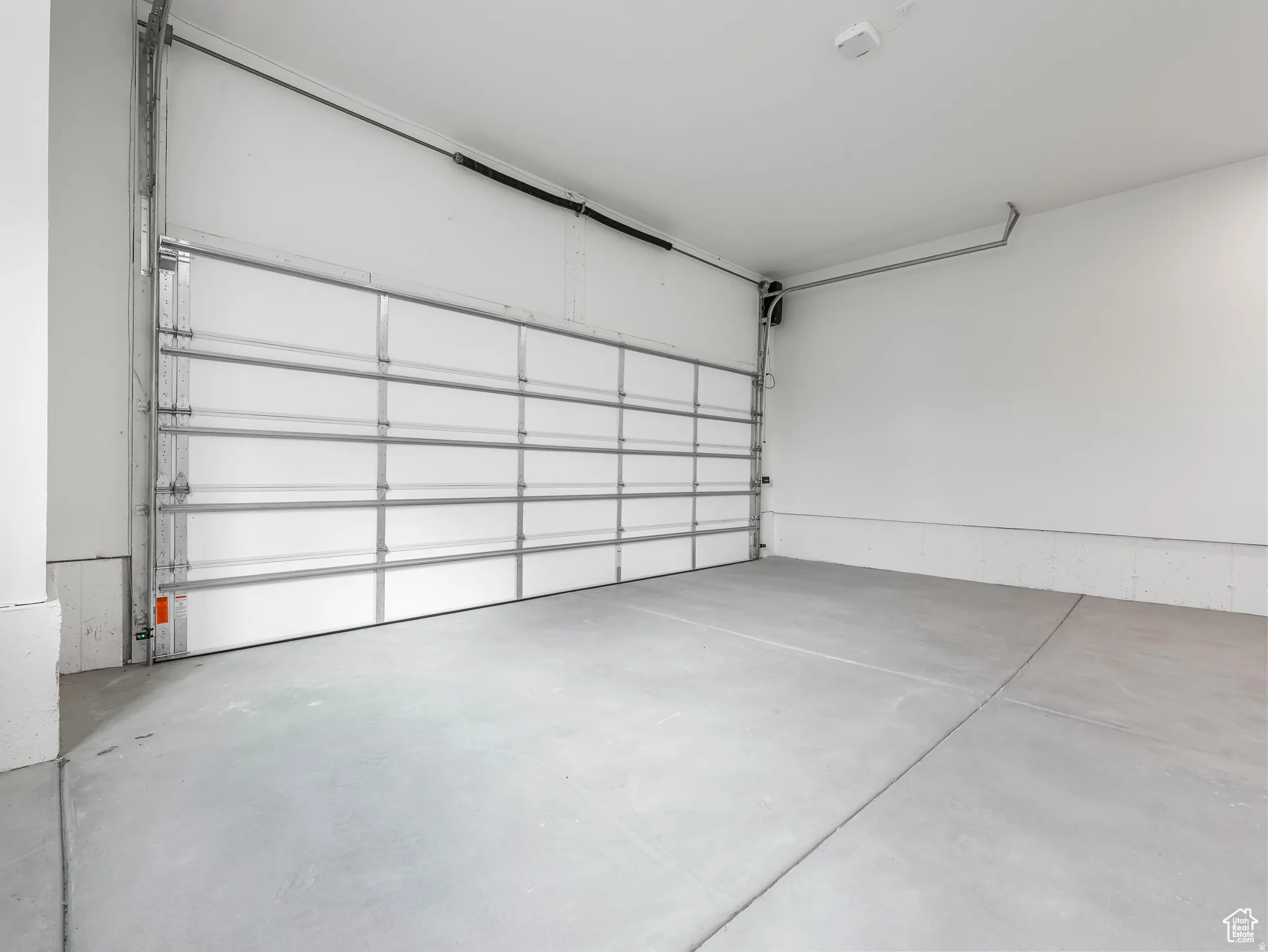 Garage has extra high ceilings, you could easily add ceiling storage/shelving