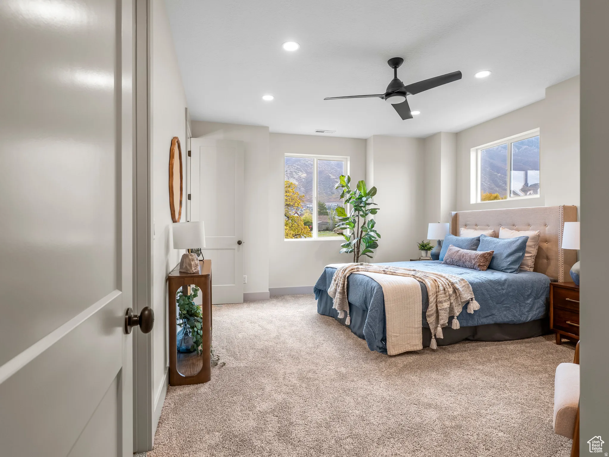Primary suite with large oversized windows and views of the mountains, two oversized closets