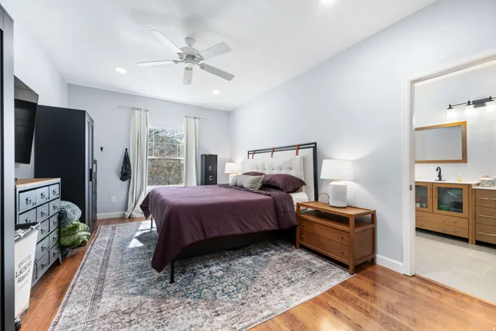 Bedroom featuring light wood-style floors and a ceiling fan