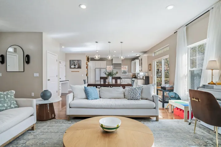 Living room with wood finished floors and recessed lighting