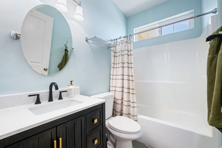 Full bath with vanity and shower / tub combo with curtain