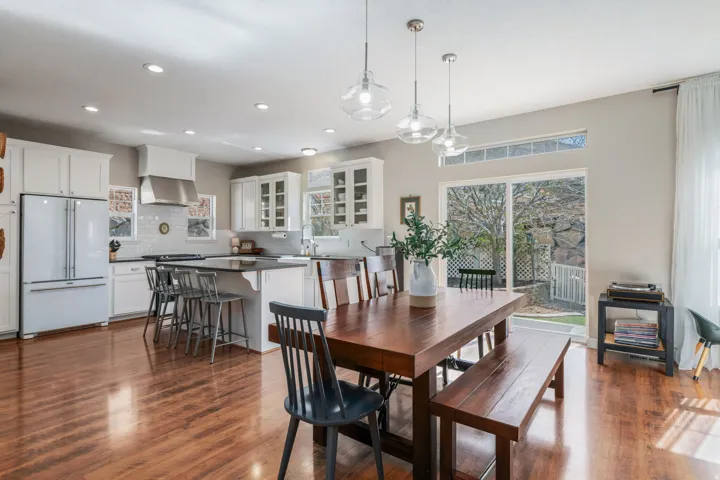 Dining room featuring dark wood finished floors and recessed lighting