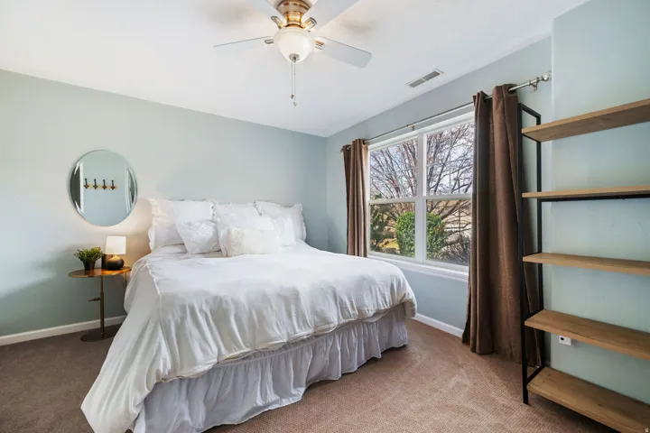 Bedroom with carpet flooring and a ceiling fan