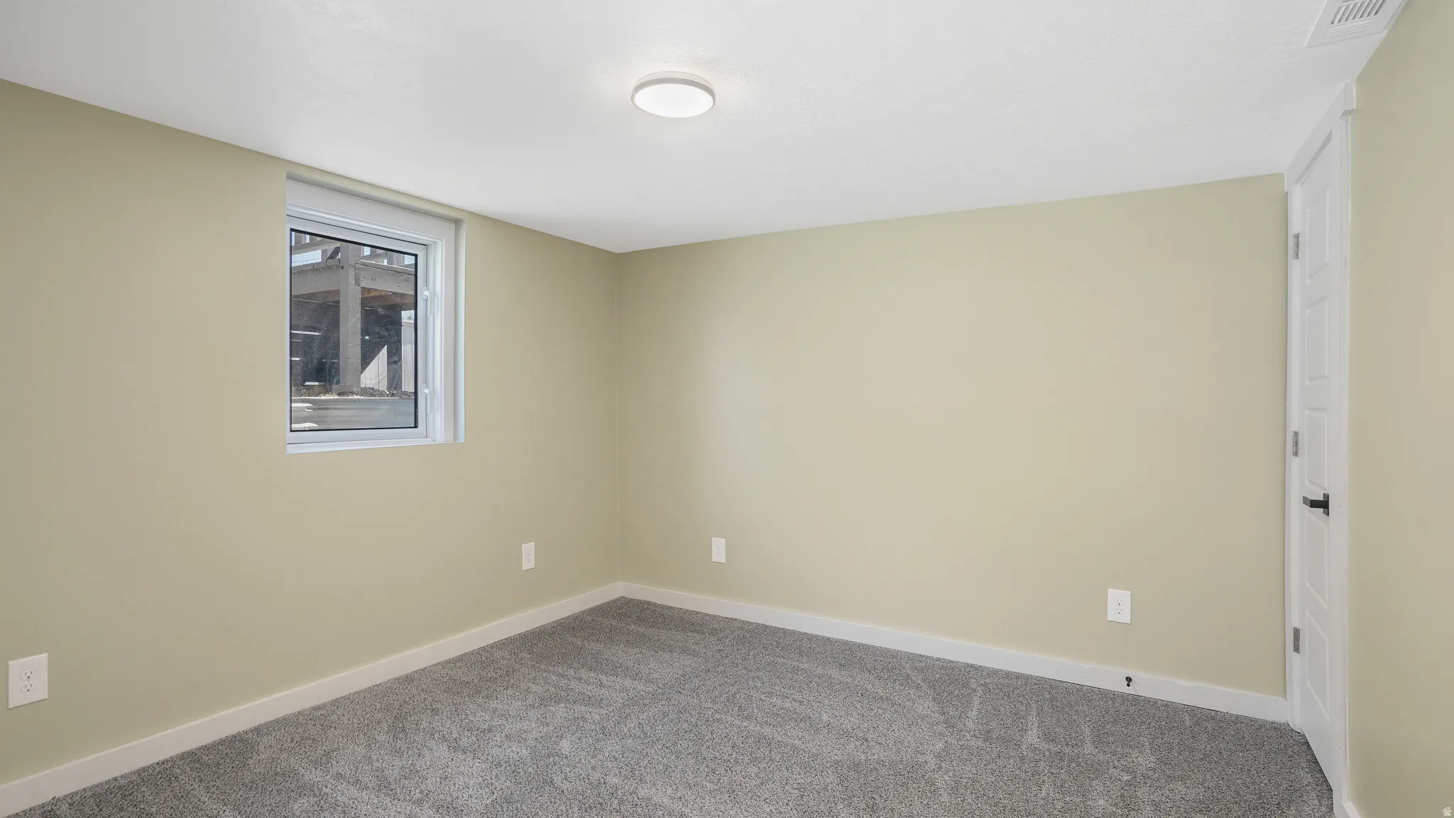 Unfurnished room with baseboards and carpet floors