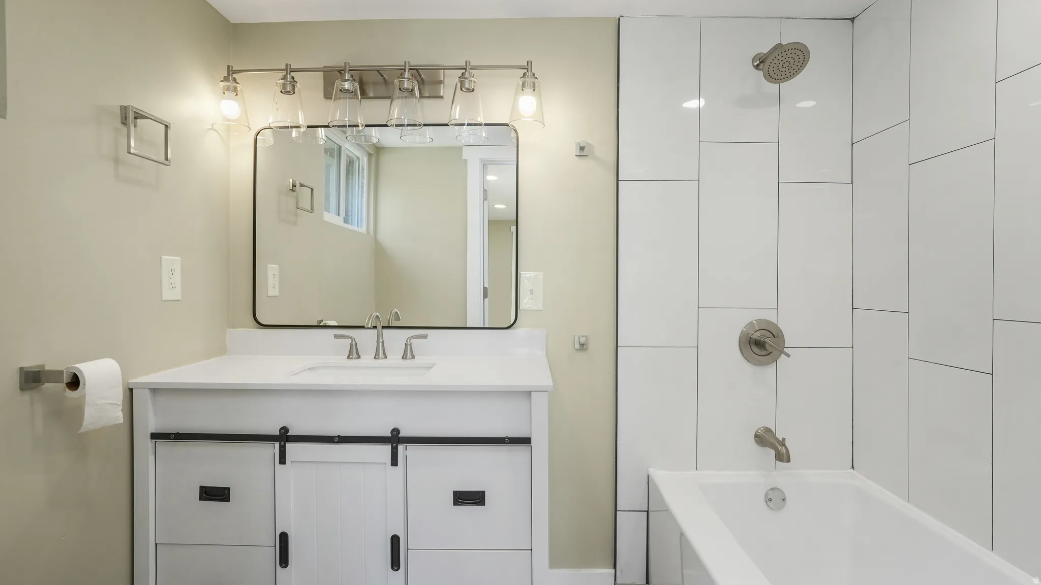 Bathroom with vanity and shower / bath combination