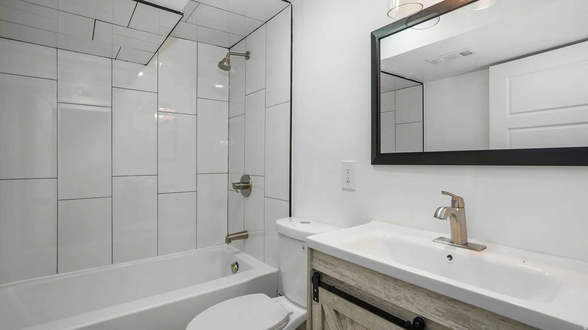 Full bathroom with vanity and shower / bath combination