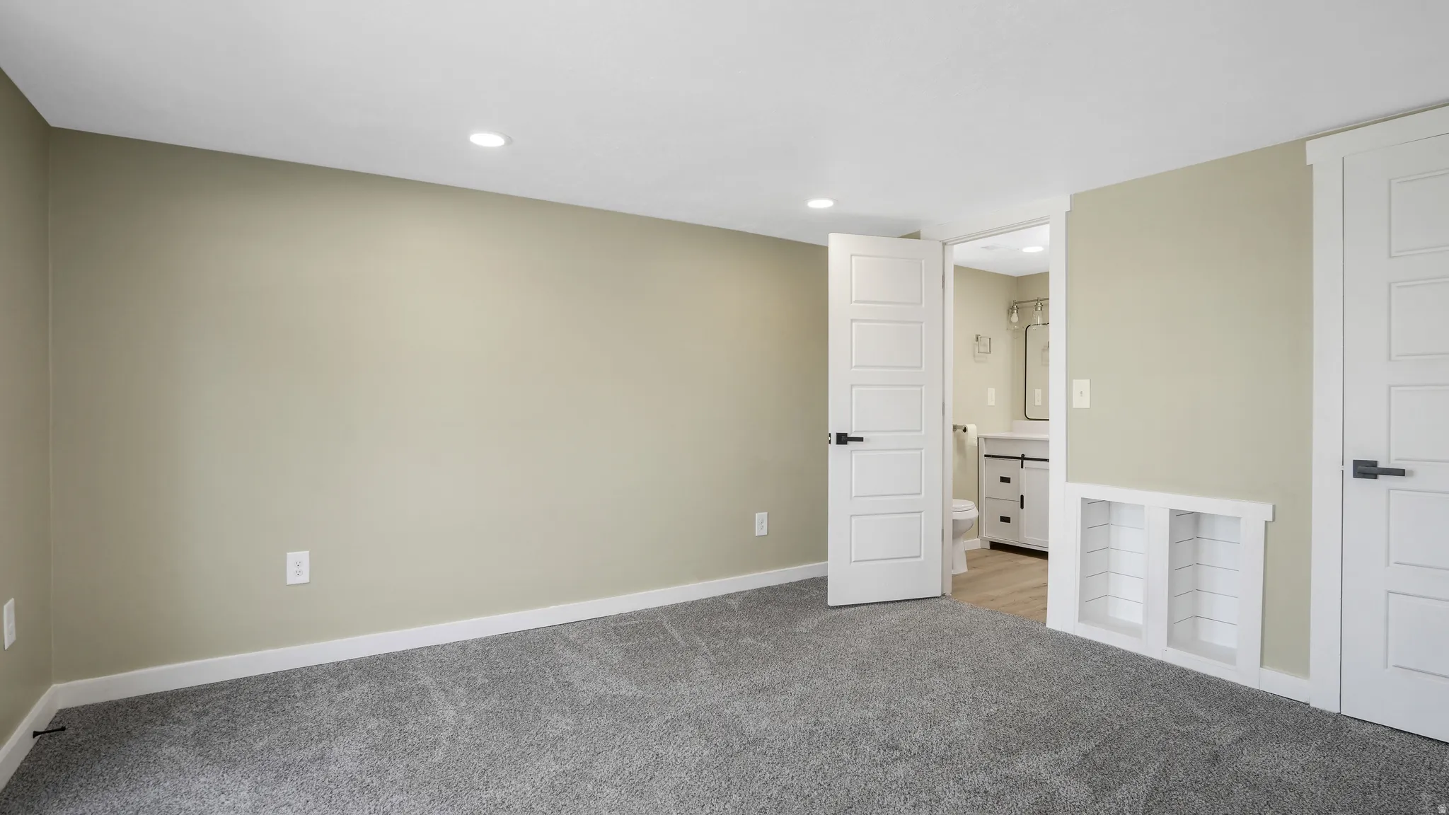 Unfurnished bedroom featuring carpet floors and recessed lighting
