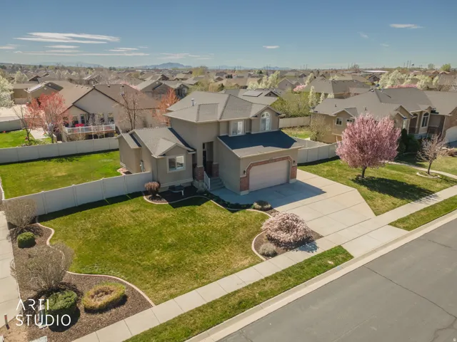 Aerial view of residential area showing fully fenced back yard.