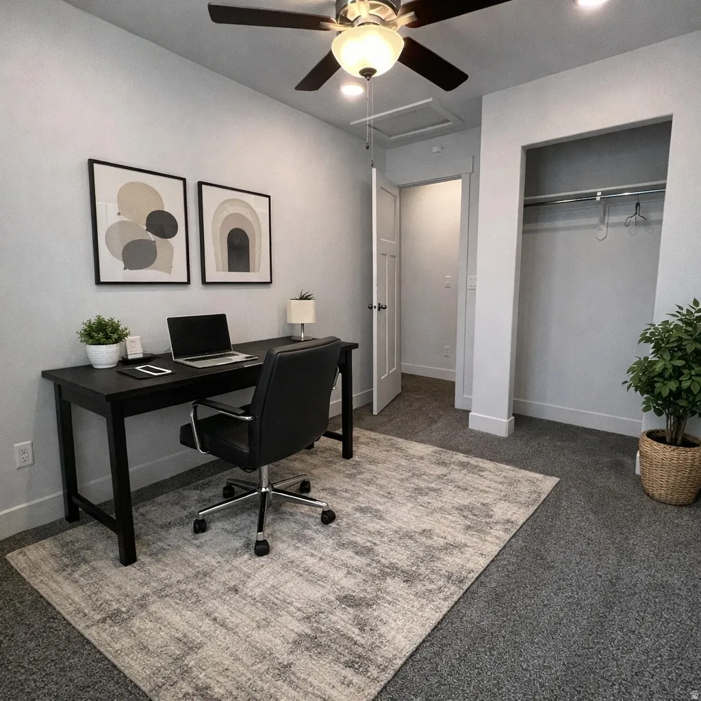 Office with ceiling fan and carpet flooring