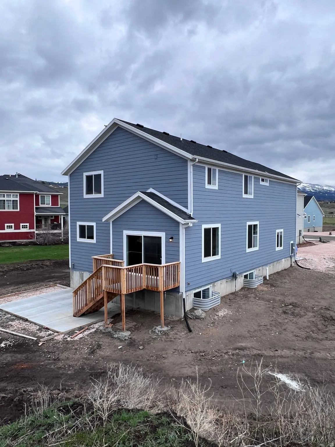 Back of property with a wooden deck