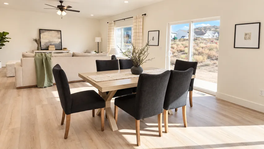 Recessed lighting, wood-finish flooring, sliding glass door, ceiling fan, and window with checkered drapes