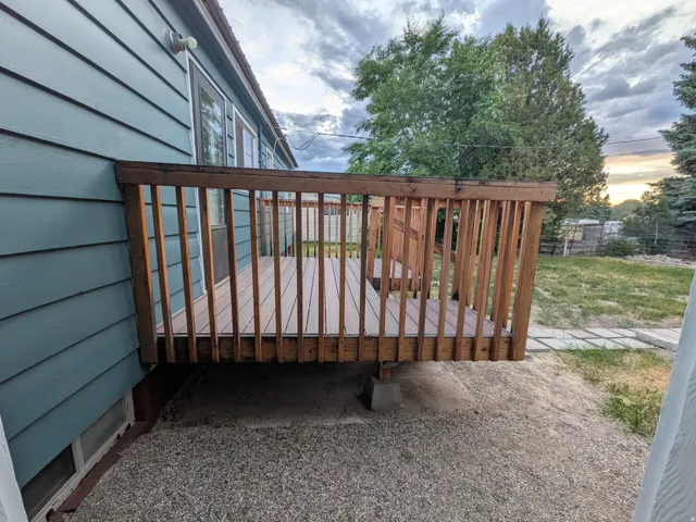 Outdoor deck featuring wood railings and composite decking