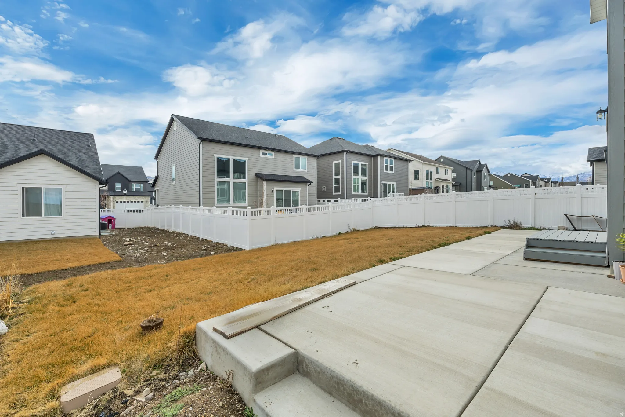 Back of property with a patio area, a residential view, and a fenced backyard