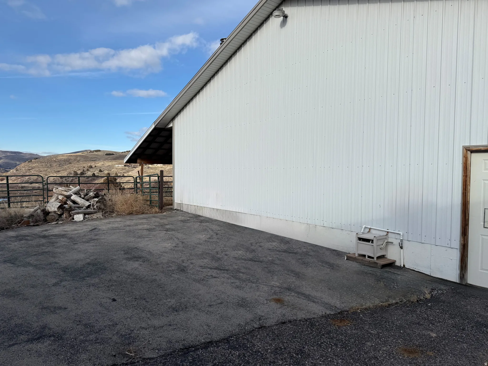 View of home's exterior featuring a mountain view and an outdoor structure