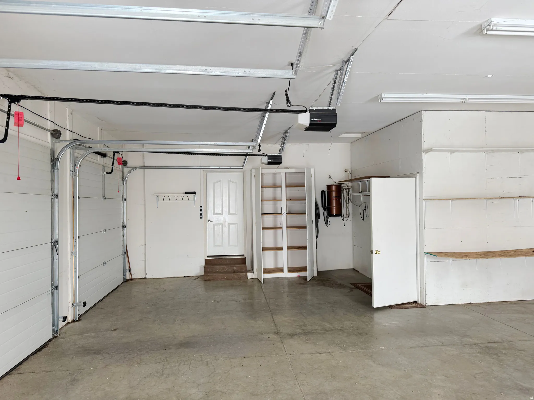 Garage featuring a garage door opener