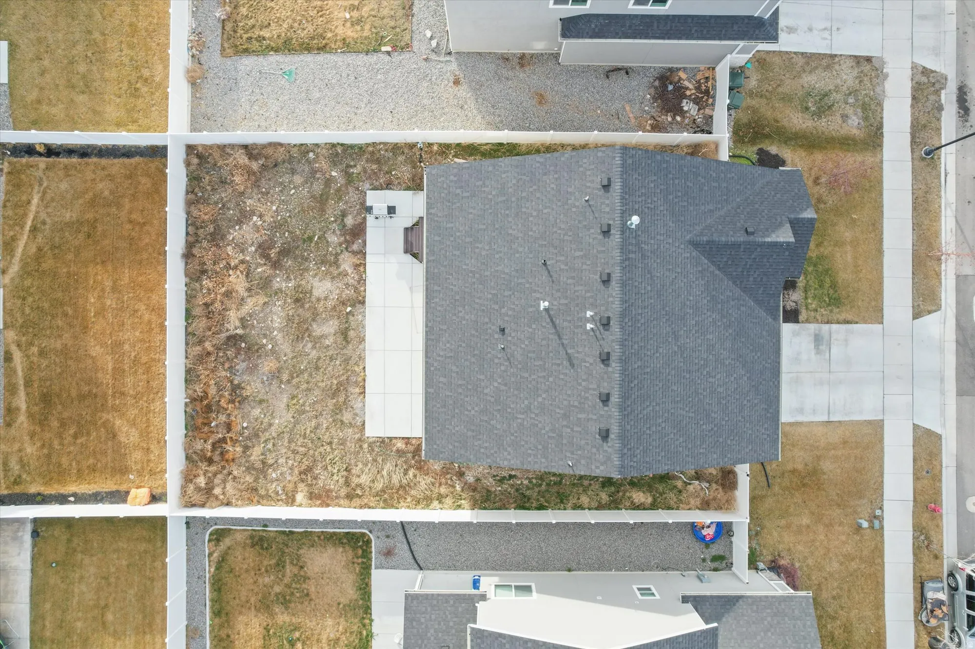 Aerial view of top of the house including front and back yard.