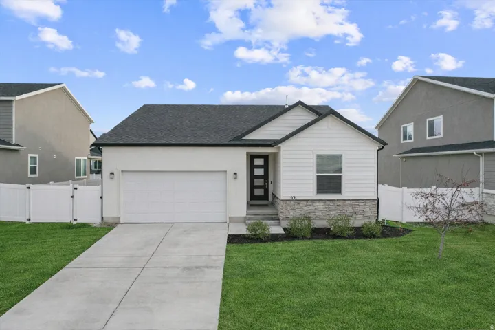 Front view of home ** Image has been edited to show what the home would look like with green grass.**