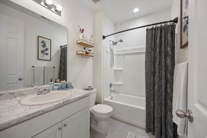 Full bathroom featuring vanity, shower / bath combination