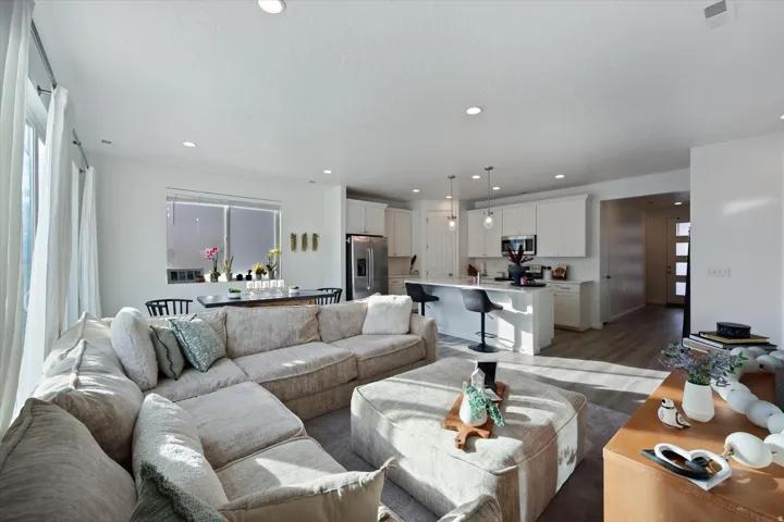 Open concept living with large open space including living room, dinning room and kitchen.