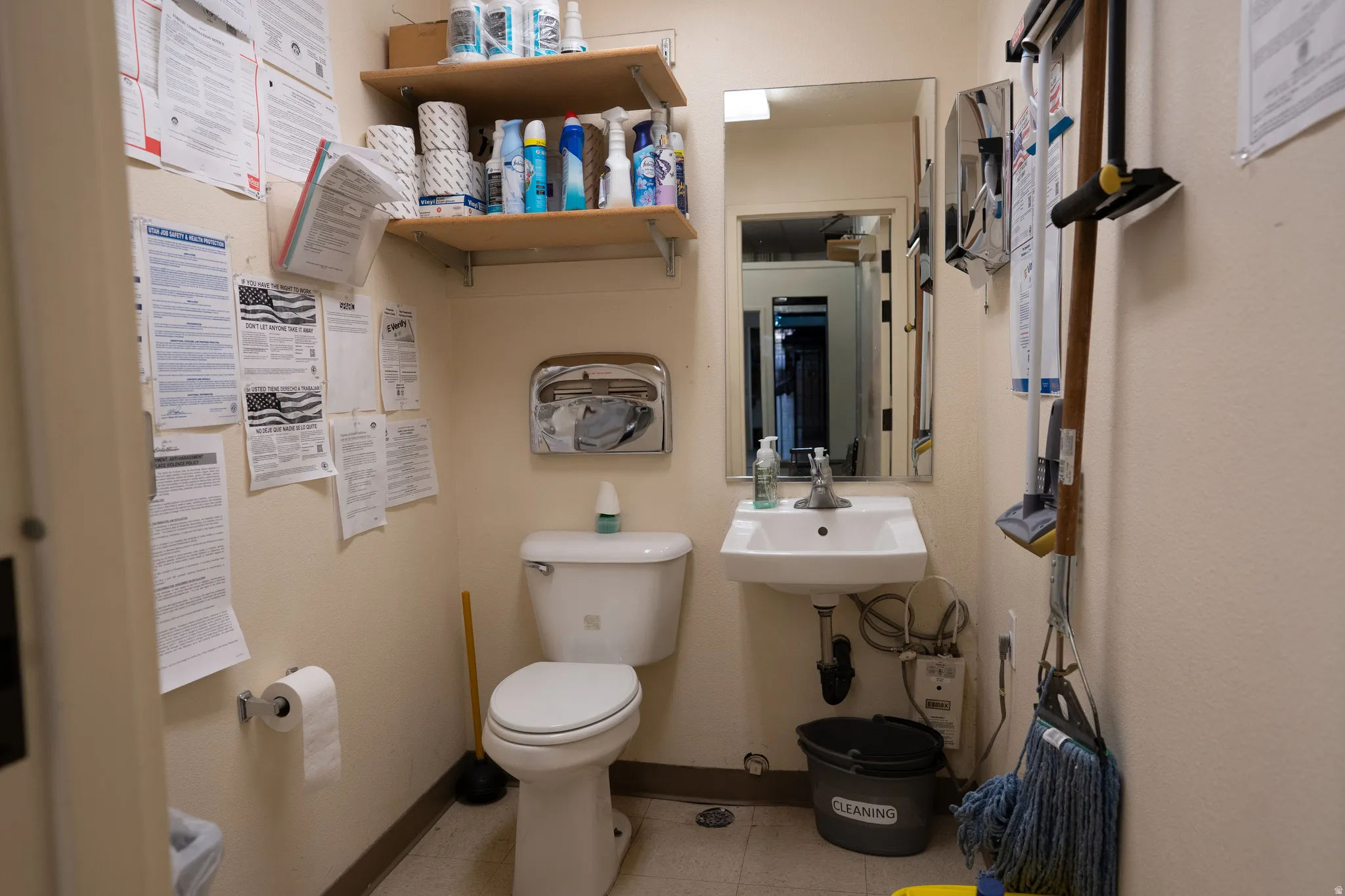 Half bath featuring toilet and baseboards