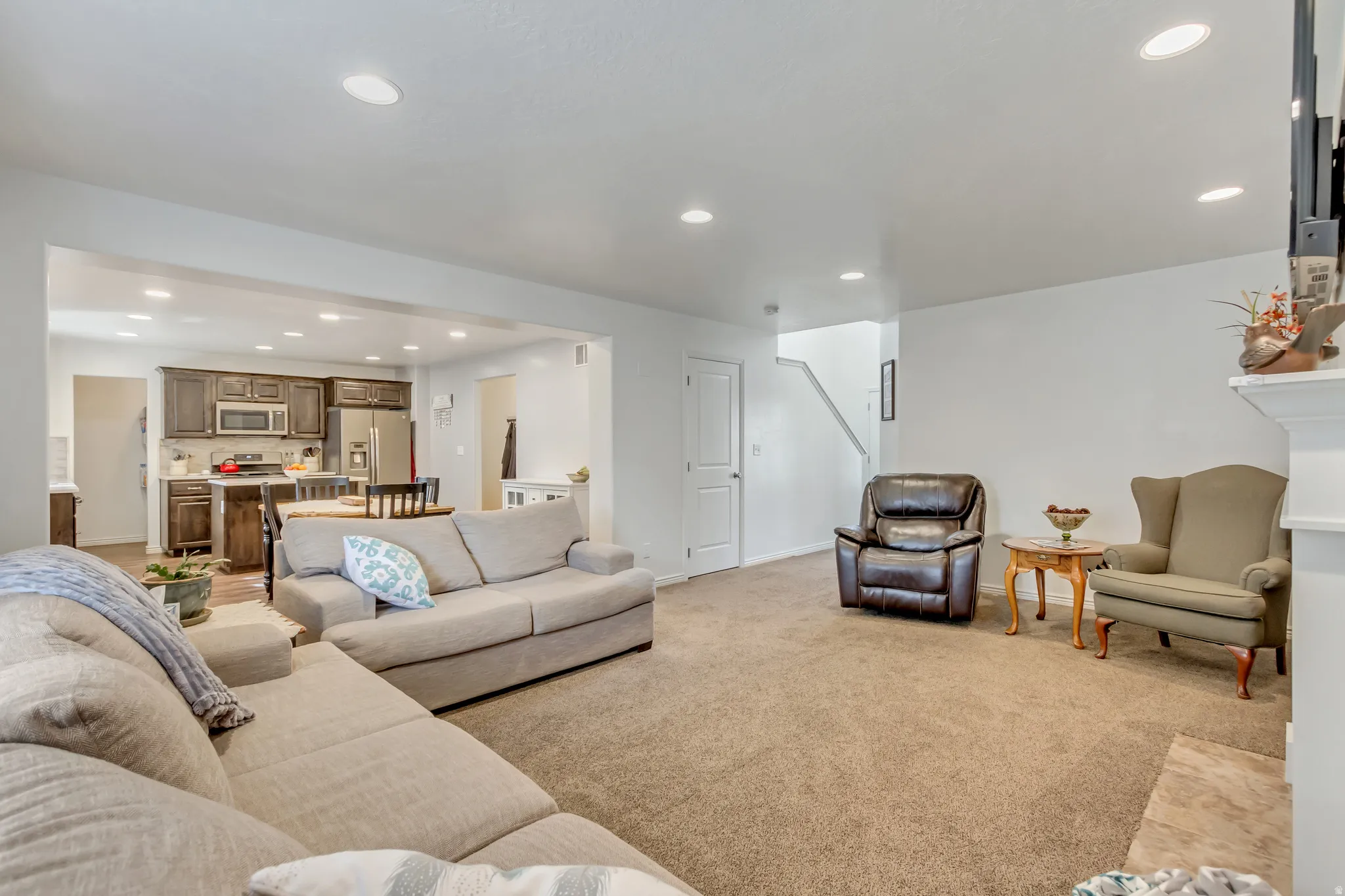 Living room featuring recessed lighting and light carpet