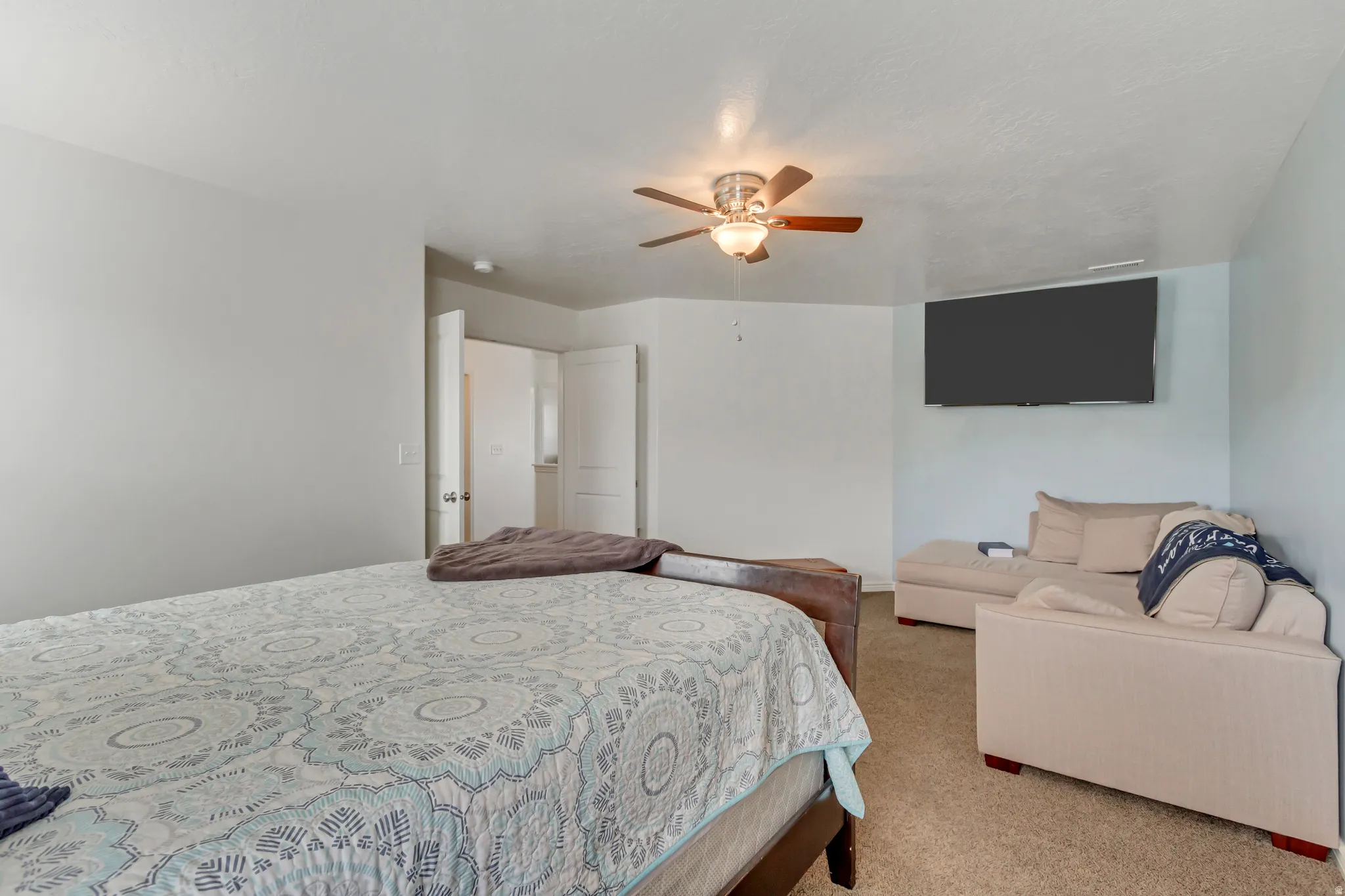 Bedroom featuring carpet flooring and a ceiling fan