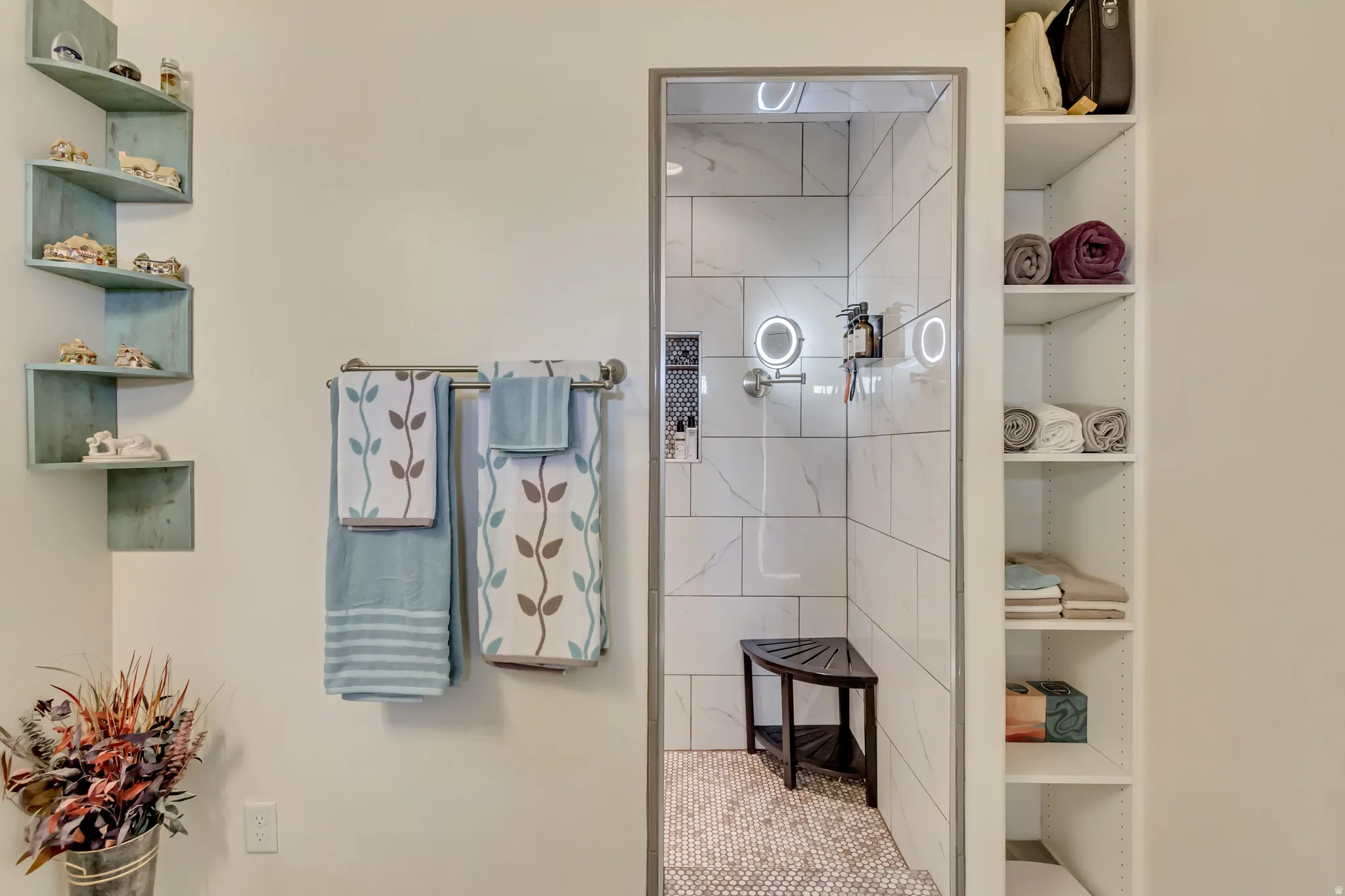 Full bathroom featuring a walk in shower and a closet