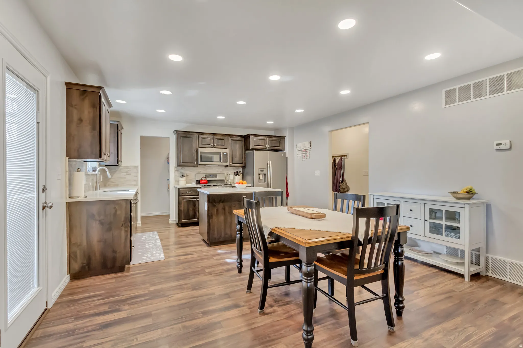 Dining area featuring recessed lighting and light wood-style floors