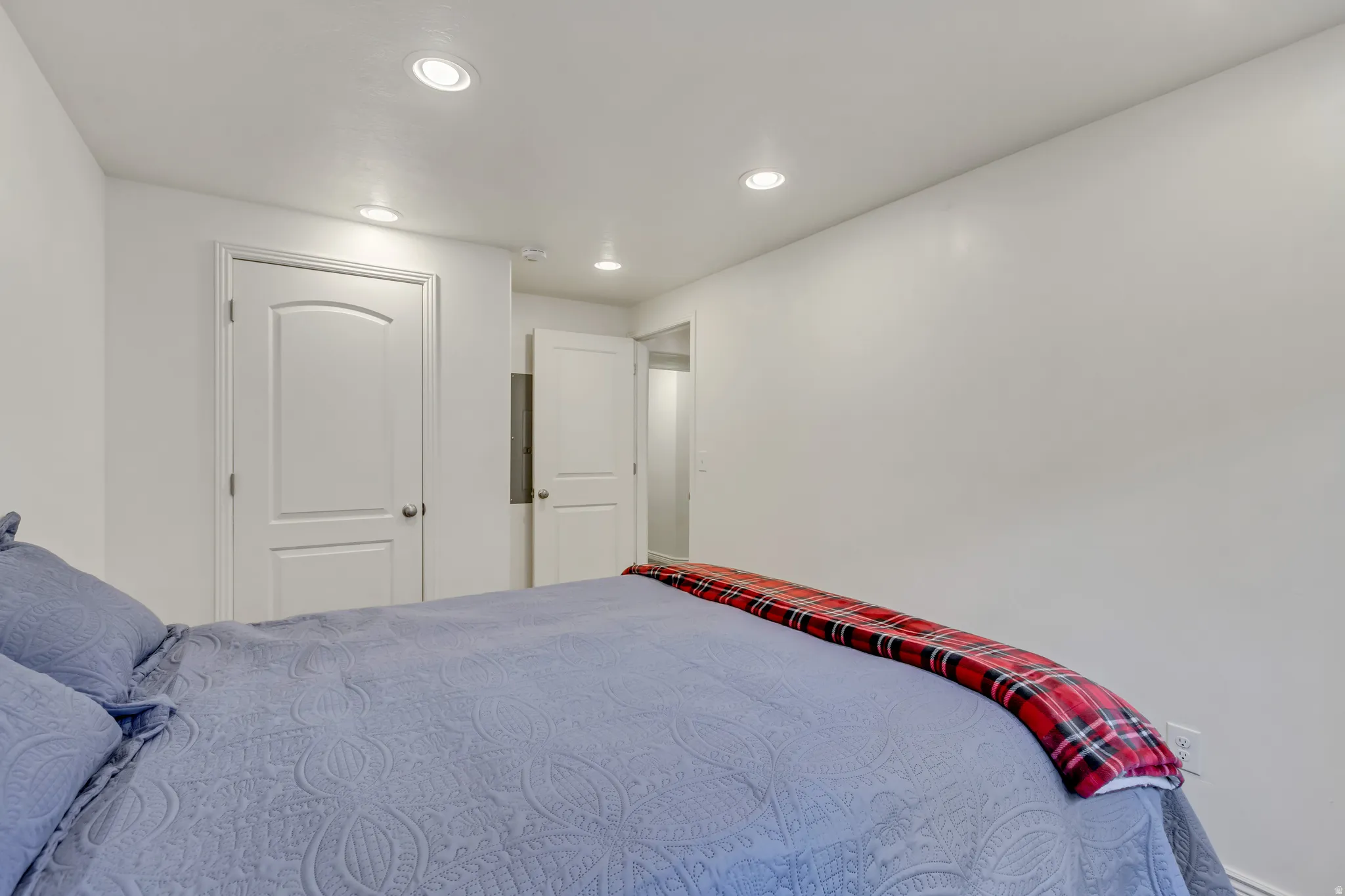 Bedroom with recessed lighting and a closet