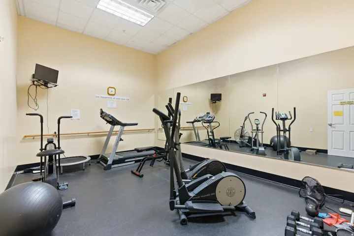 Workout area featuring a paneled ceiling